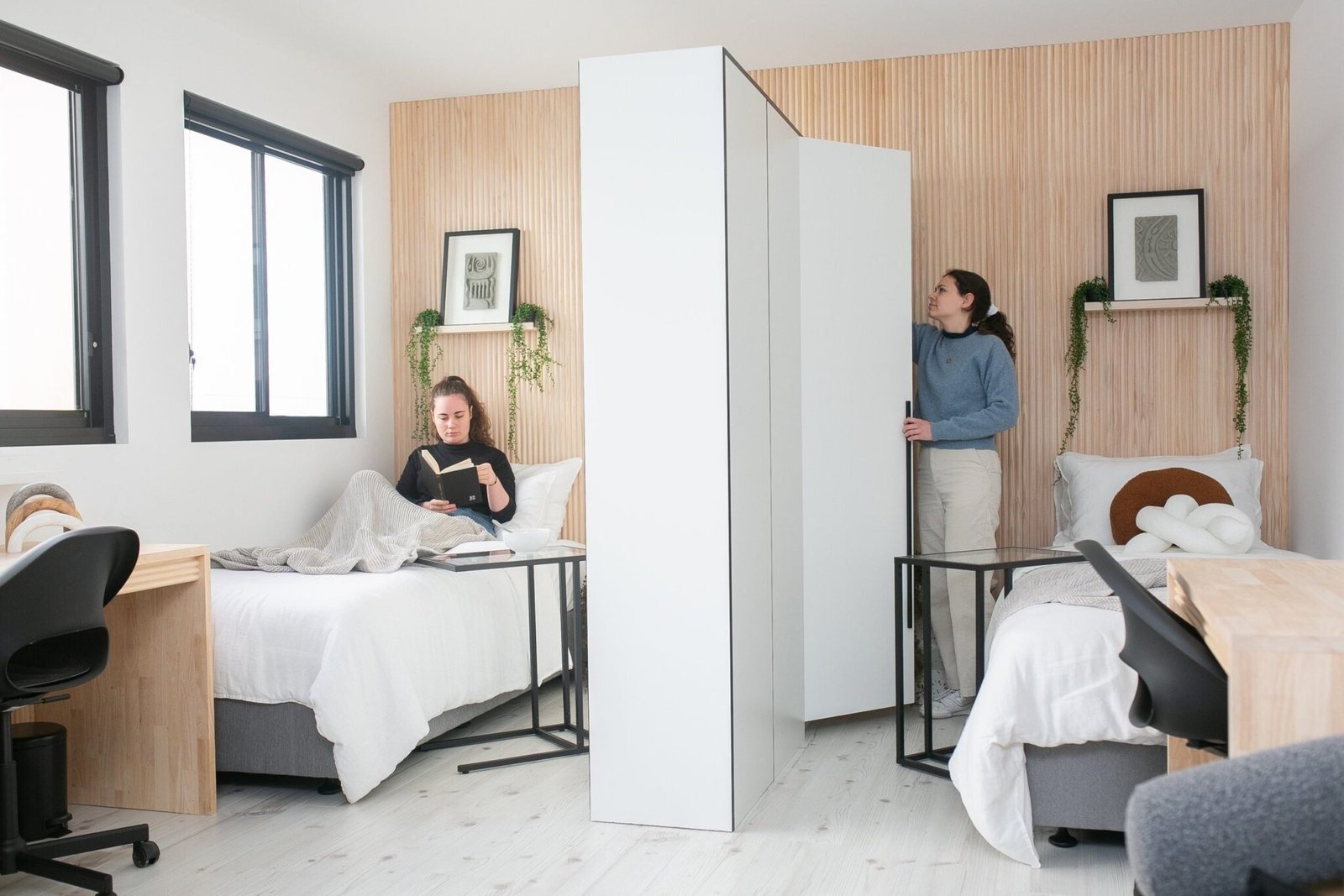 Modern bedroom with two beds and divider