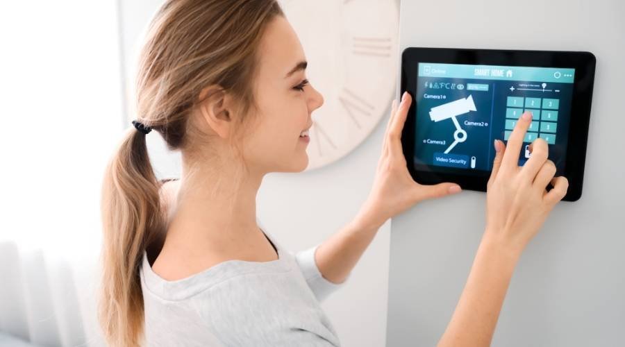 Woman using smart home control panel
