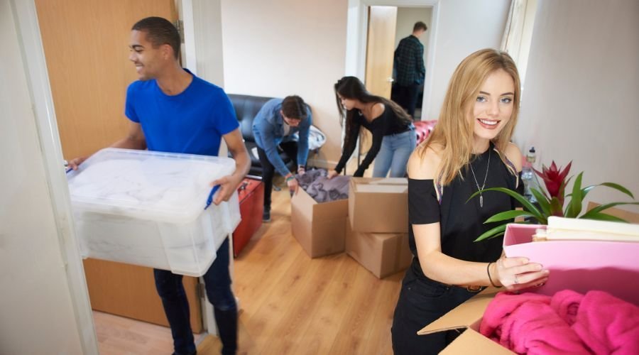 Group of friends moving into a new home.