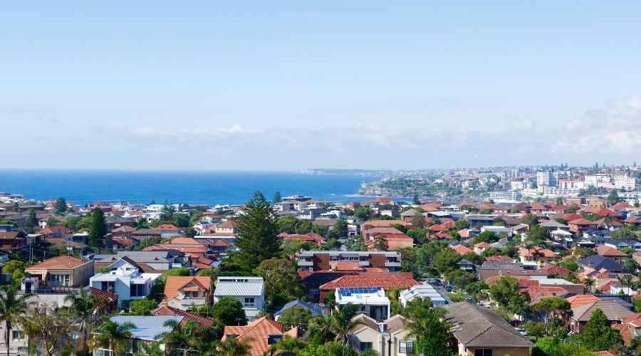 Aerial view of coastal city and ocean skyline.