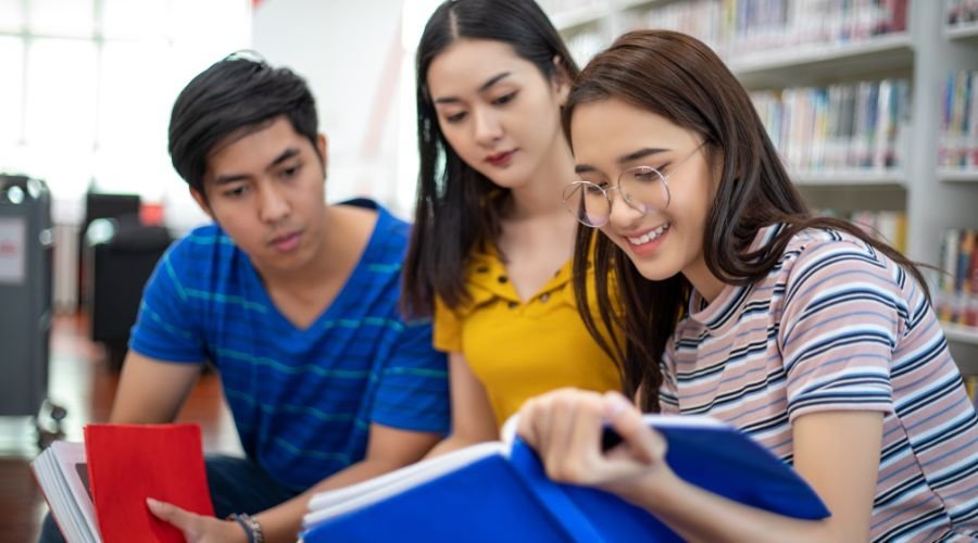 Students studying together in a library.